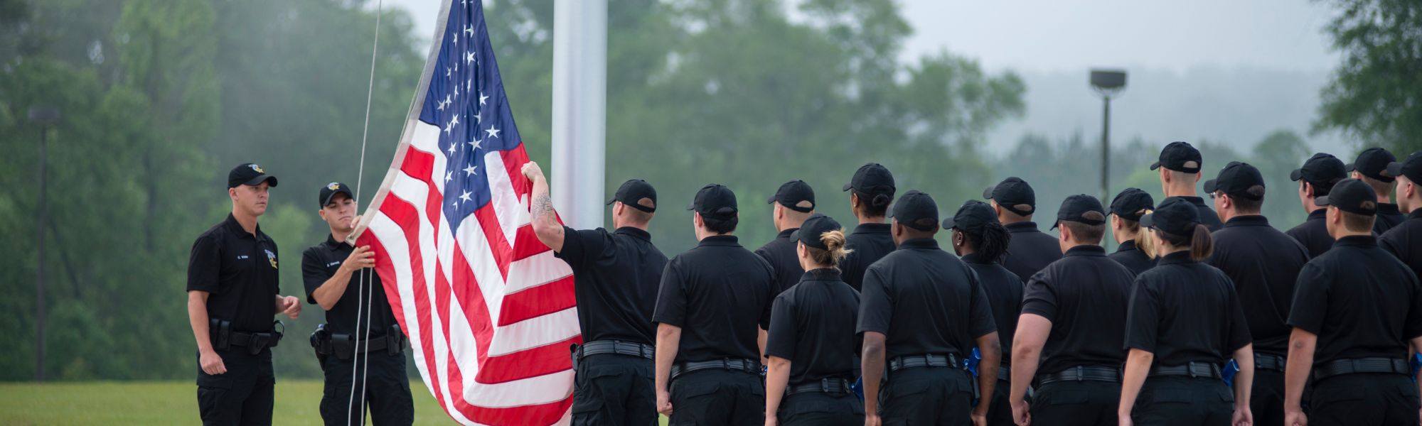 FPSI Students standing in front of the American flag.